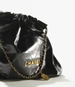 CHANEL Small 22 HANDBAG - Black & White Leather - FrasersFashion